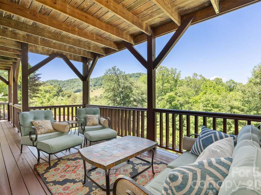 359 Saddlebrook Lane, Clyde, NC 28721.  MLS# CAR4393520, YatesRealty ID 31400. Lower level deck with views
