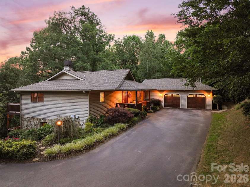 359 Saddlebrook Lane, Clyde, NC 28721.  MLS# CAR4393520, YatesRealty ID 31400. Paved driveway with attached two-car garage