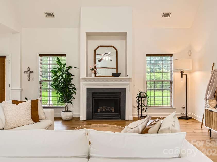 4120 Waxwood Drive, Monroe, NC 28110.  MLS# CAR4279472, YatesRealty ID 31408. Cozy fireplace with beautiful mantle.