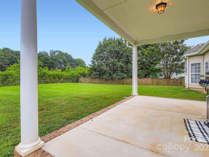 4120 Waxwood Drive, Monroe, NC 28110.  MLS# CAR4279472, YatesRealty ID 31408. Large covered patio for your enjoyment.