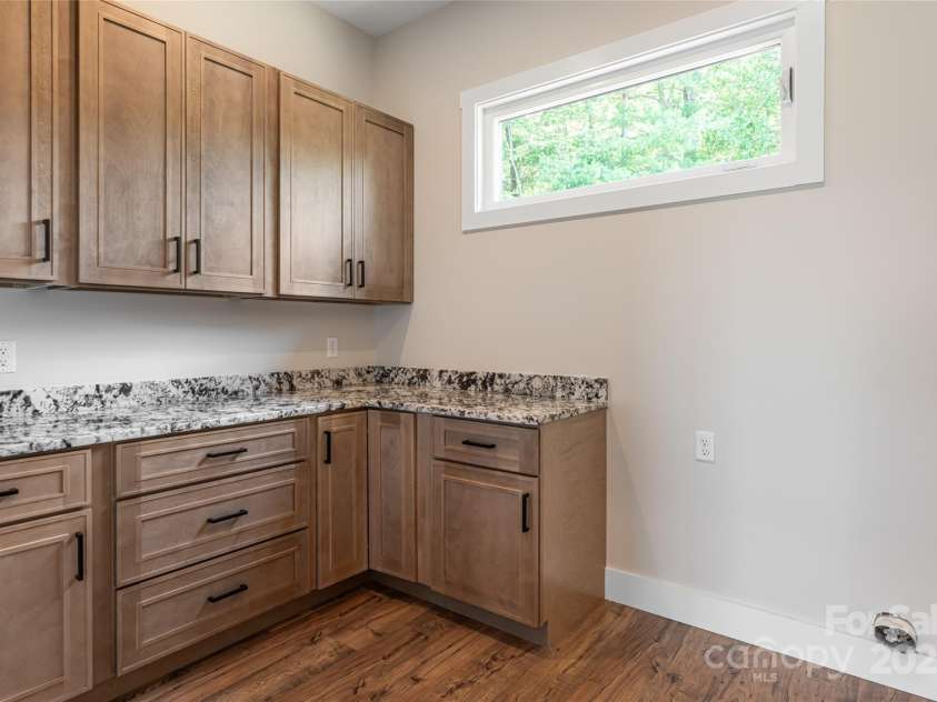 129 Parkway View Drive, Hendersonville, NC 28739.  MLS# CAR4258845, YatesRealty ID 31411. Laundry room offers incredible storage