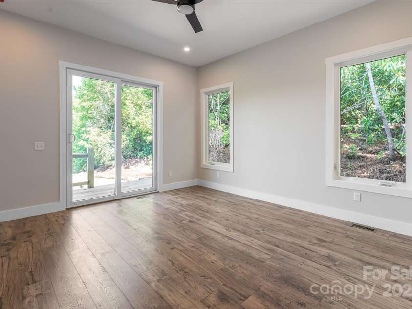 129 Parkway View Drive, Hendersonville, NC 28739.  MLS# CAR4258845, YatesRealty ID 31411. Primary suite opens to deck and mountain views