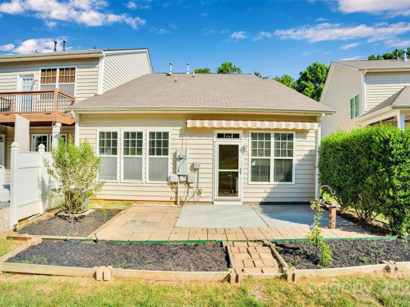1143 Crown Vista Drive, Fort Mill, SC 29707.  MLS# CAR4285889, YatesRealty ID 31412. Patio with Flowerbeds