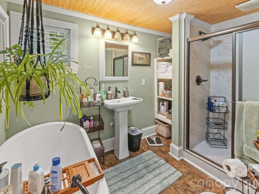1832 Badin Road, Albemarle, NC 28001.  MLS# CAR4392071, YatesRealty ID 31414. Downstair bath has a large shower and soaking tub.