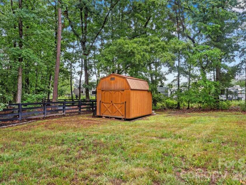 1832 Badin Road, Albemarle, NC 28001.  MLS# CAR4392071, YatesRealty ID 31414. Storage building conveys with the property.