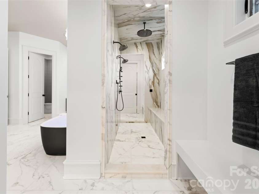 316 Braeside Court, Asheville, NC 28803.  MLS# CAR4198099, YatesRealty ID 3143. Along with a walk-through steam shower complete the spa-like experience