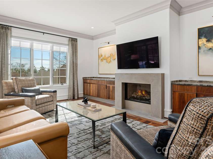 316 Braeside Court, Asheville, NC 28803.  MLS# CAR4198099, YatesRealty ID 3143. Beautiful black walnut cabinets to match the black walnut hardwoods and re-imagined fireplace surround in a sleek concrete set the tone for this cozy space