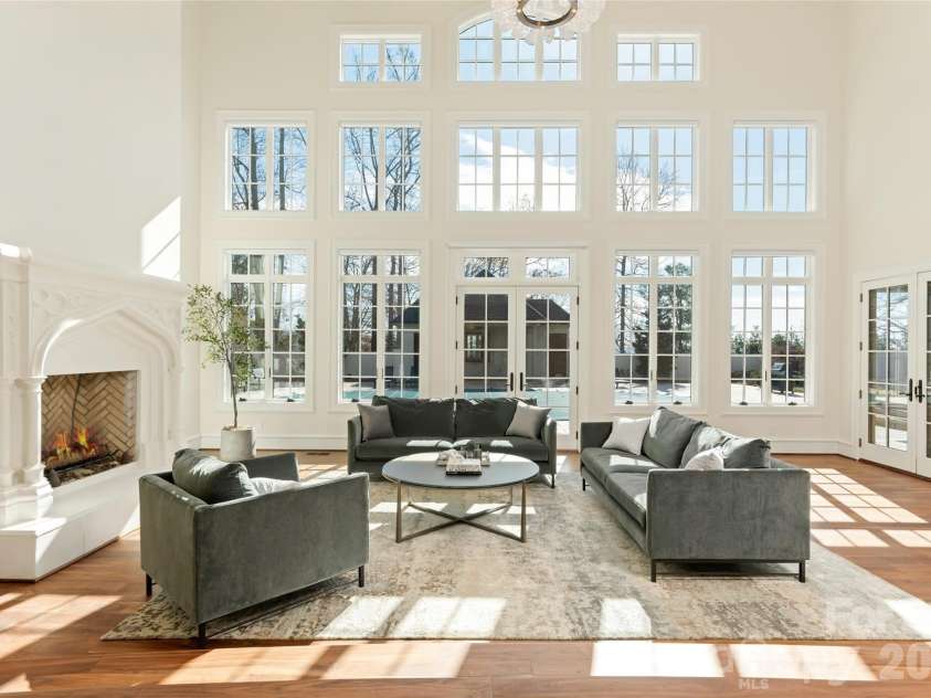 316 Braeside Court, Asheville, NC 28803.  MLS# CAR4198099, YatesRealty ID 3143. Gorgeous natural light from the wall of windows fills the heart of the home in its 2-story great room