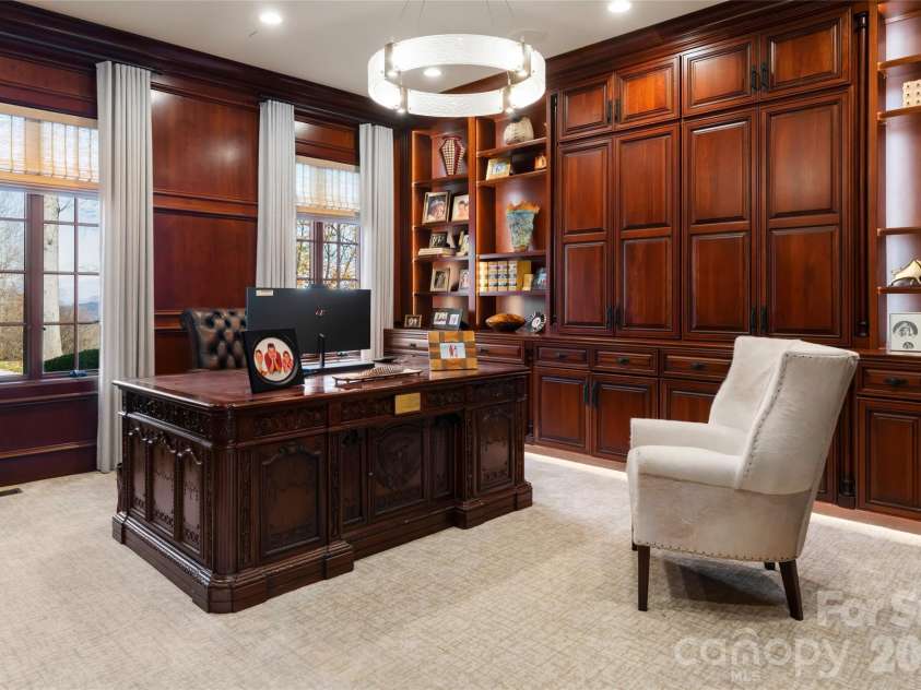 316 Braeside Court, Asheville, NC 28803.  MLS# CAR4198099, YatesRealty ID 3143. Handsome cherry wood-encased office/study on the main level