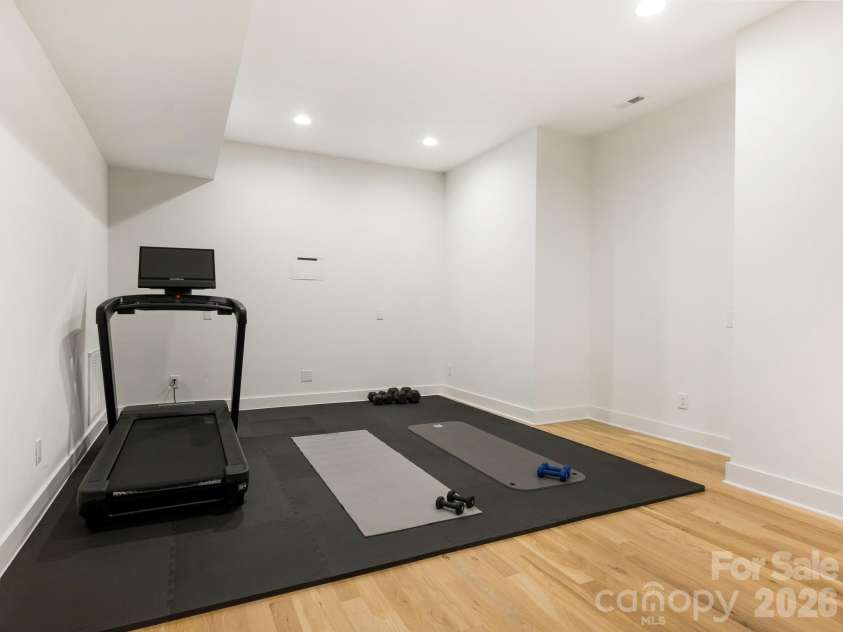 3601 Woody Grove Lane, Charlotte, NC 28210.  MLS# CAR4380181, YatesRealty ID 31430. Lower Level Gym