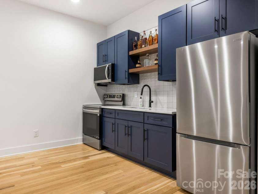 3601 Woody Grove Lane, Charlotte, NC 28210.  MLS# CAR4380181, YatesRealty ID 31430. Lower Level Kitchen