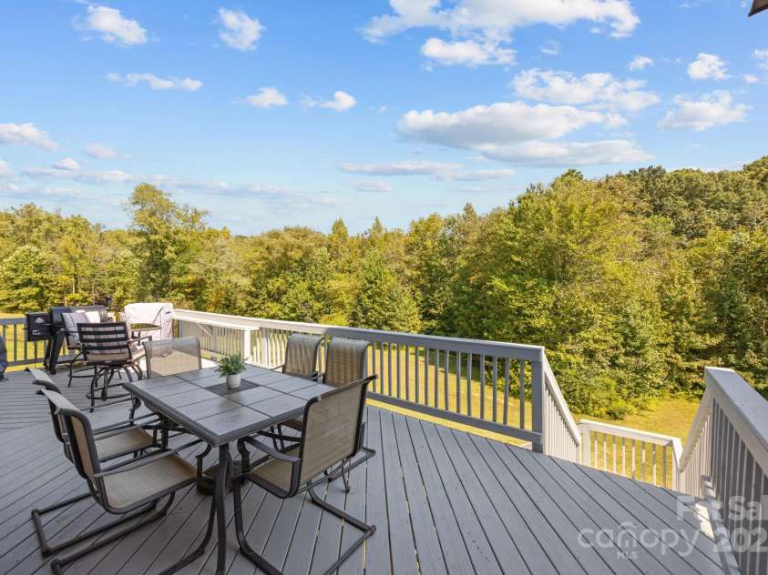 141 Rain Shadow Drive, Mooresville, NC 28115.  MLS# CAR4305913, YatesRealty ID 3144. Expanded Deck to enjoy grilling & chilling