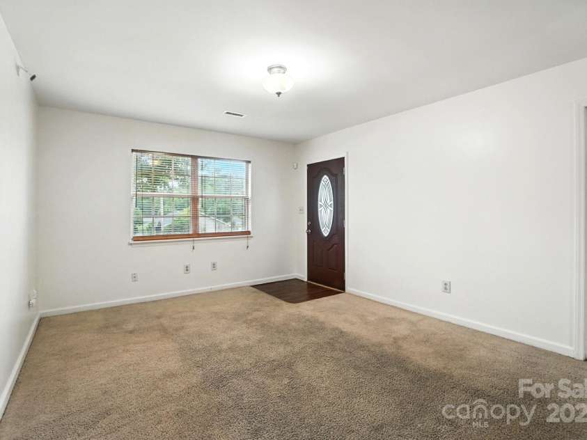 831 Flicker Street, Concord, NC 28027.  MLS# CAR4287829, YatesRealty ID 31455. Main living room w/ primary off main.