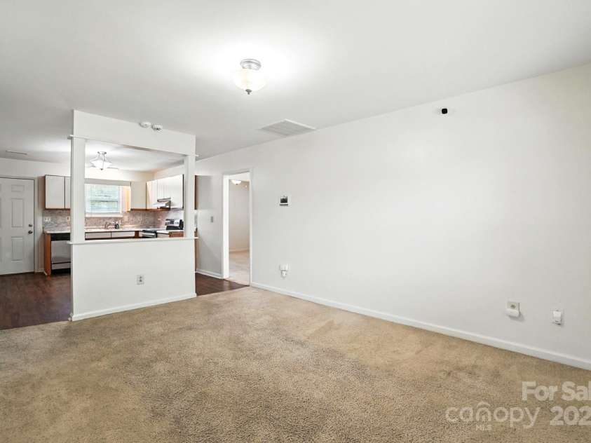 831 Flicker Street, Concord, NC 28027.  MLS# CAR4287829, YatesRealty ID 31455. Open concept living room looking into kitchen