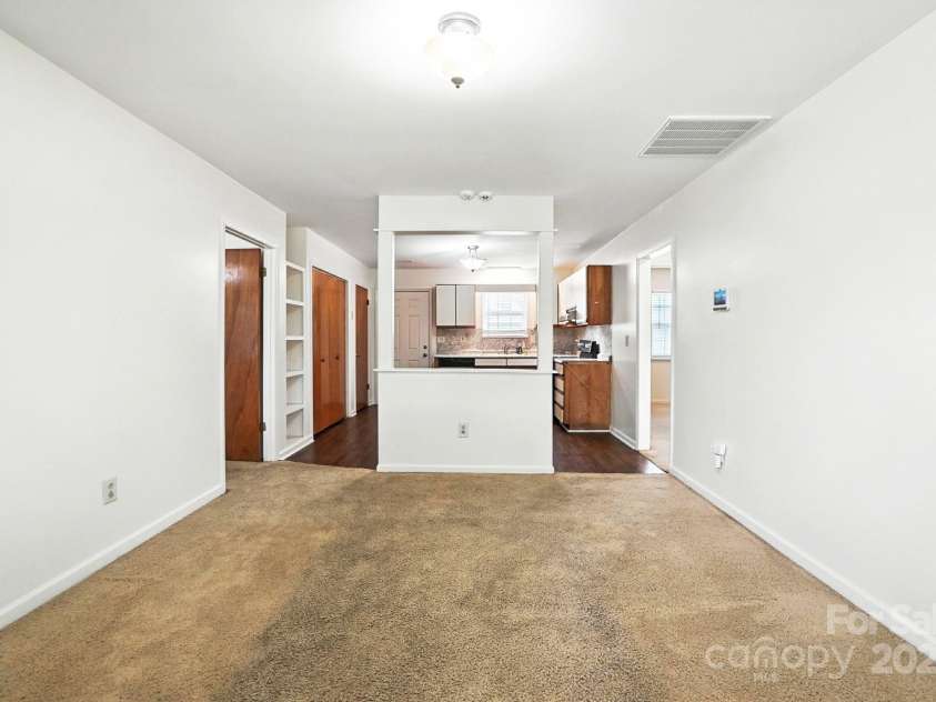 831 Flicker Street, Concord, NC 28027.  MLS# CAR4287829, YatesRealty ID 31455. Open concept living room looking into kitchen