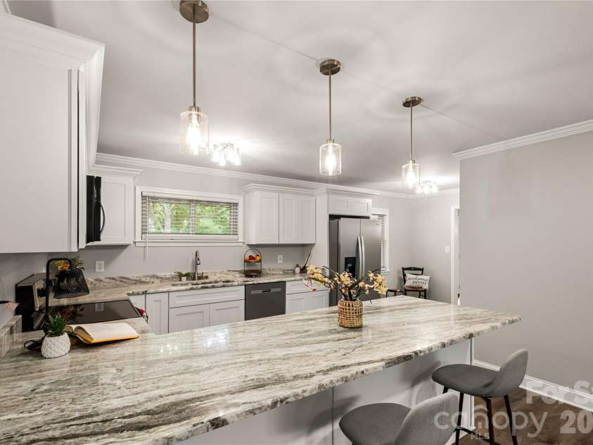 1297 Potter Road, Lancaster, SC 29720.  MLS# CAR4391936, YatesRealty ID 31456. Kitchen with Breakfast Bar