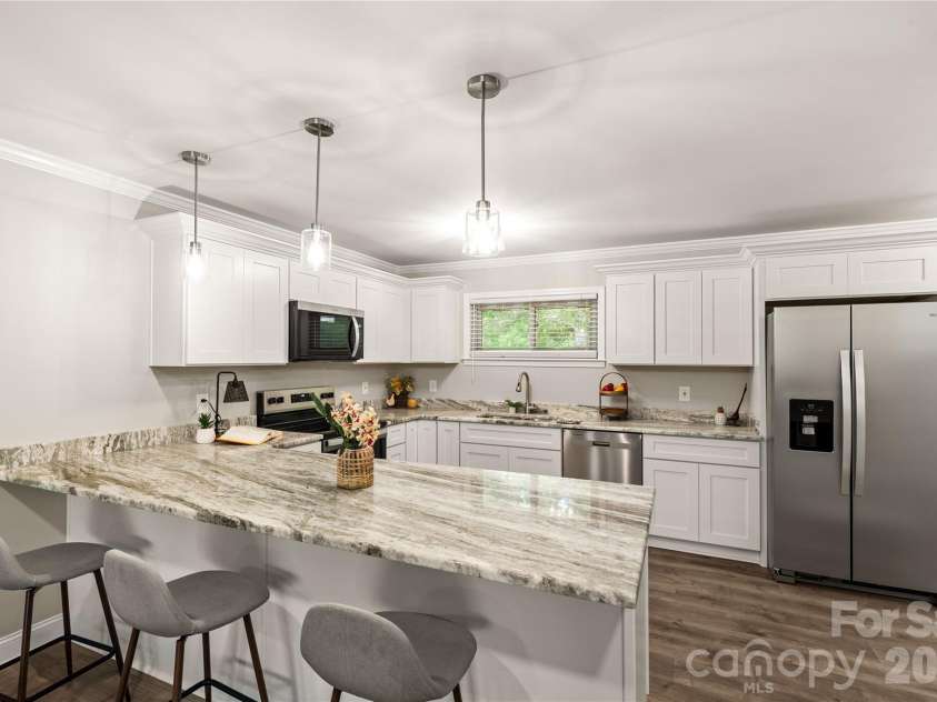 1297 Potter Road, Lancaster, SC 29720.  MLS# CAR4391936, YatesRealty ID 31456. Kitchen with Breakfast Bar