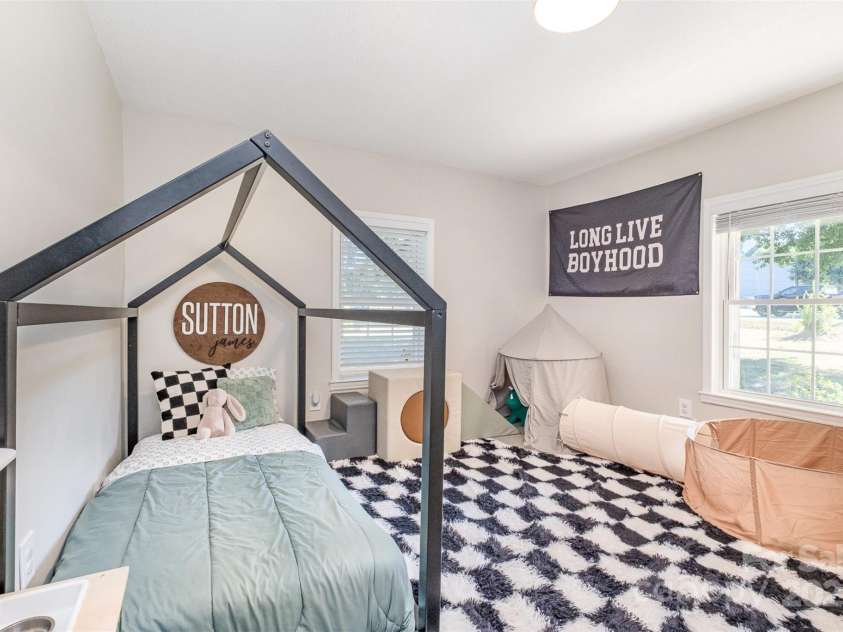 754 Rubens Road, Concord, NC 28027.  MLS# CAR4283491, YatesRealty ID 31457. Discover the exceptional size of this secondary bedroom; it's a rare find in most homes! Experience the joy of natural light flooding in, creating a bright and inviting atmosphere. This room is not just large; it's perfectly