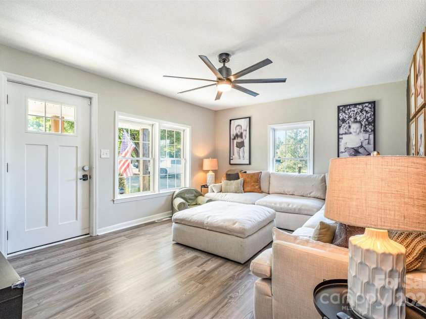 754 Rubens Road, Concord, NC 28027.  MLS# CAR4283491, YatesRealty ID 31457. Step inside and be greeted by the welcoming ambiance of this expansive and beautifully designed space. The heart of the home, this inviting great room is flooded with natural light, creating a warm and cheerful atmosphere. E