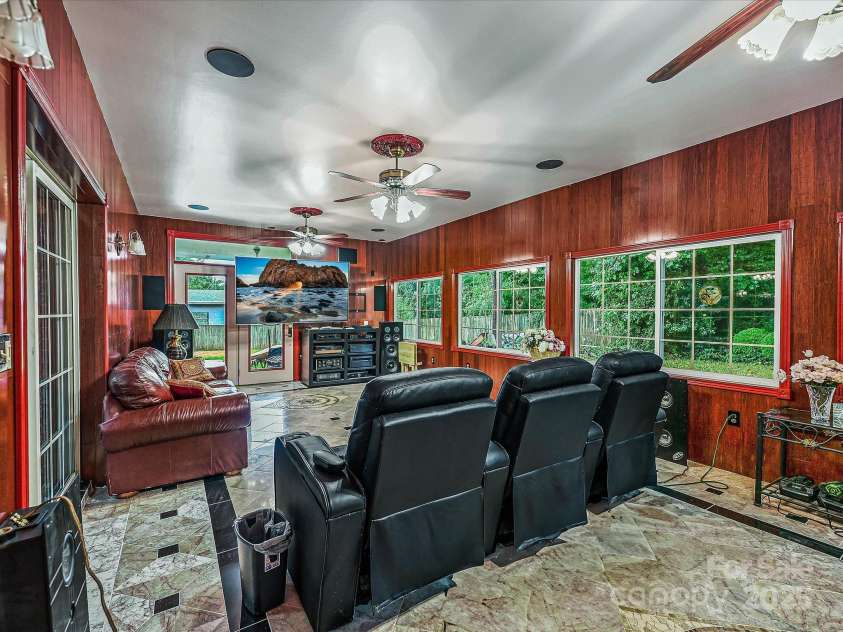 4900 Rocky River Road, Charlotte, NC 28215.  MLS# CAR4283934, YatesRealty ID 31470. Another view of Solarium - lots of windows, has exit door to backyard