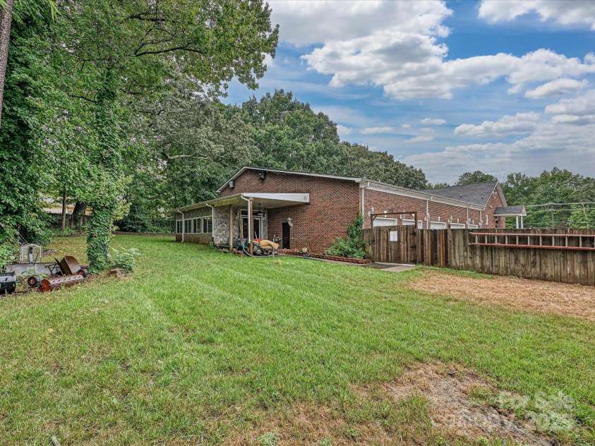 4900 Rocky River Road, Charlotte, NC 28215.  MLS# CAR4283934, YatesRealty ID 31470. Backyard shows back of house
