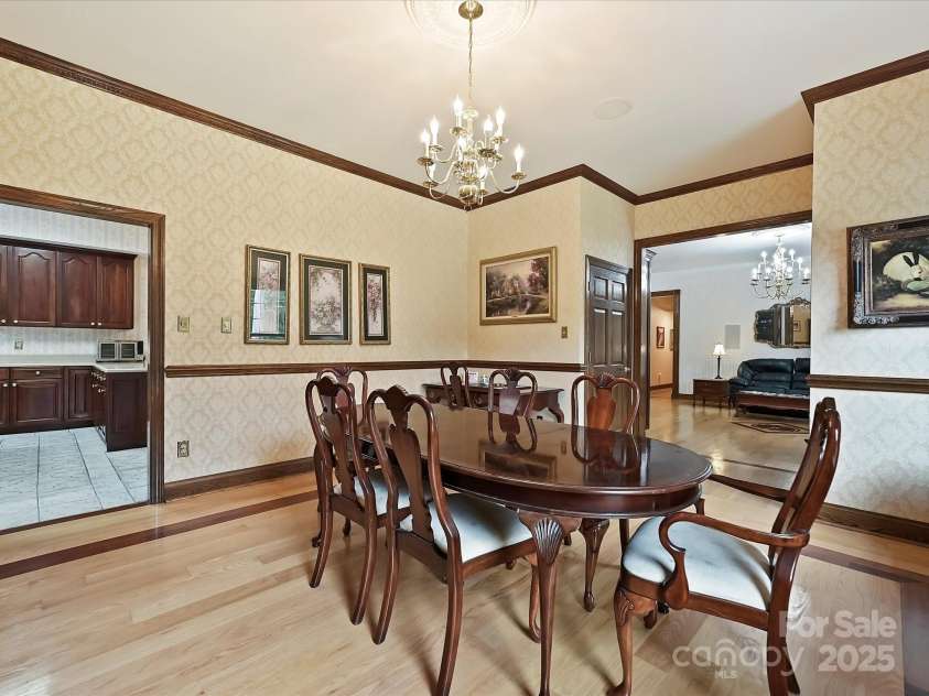 4900 Rocky River Road, Charlotte, NC 28215.  MLS# CAR4283934, YatesRealty ID 31470. DR showing entry to Kitchen & LR