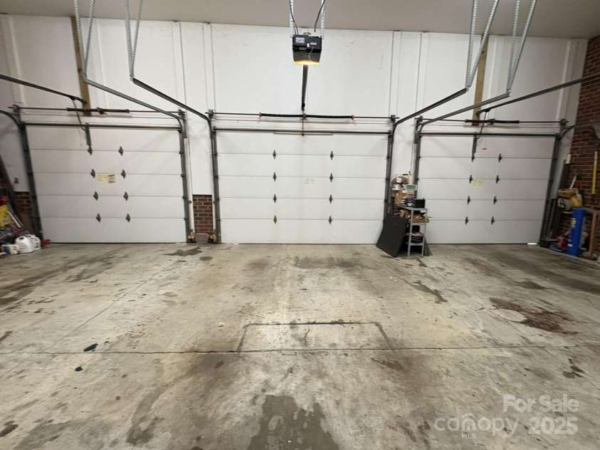 4900 Rocky River Road, Charlotte, NC 28215.  MLS# CAR4283934, YatesRealty ID 31470. Garage 1-3; garage 4-5 is separated by brick wall