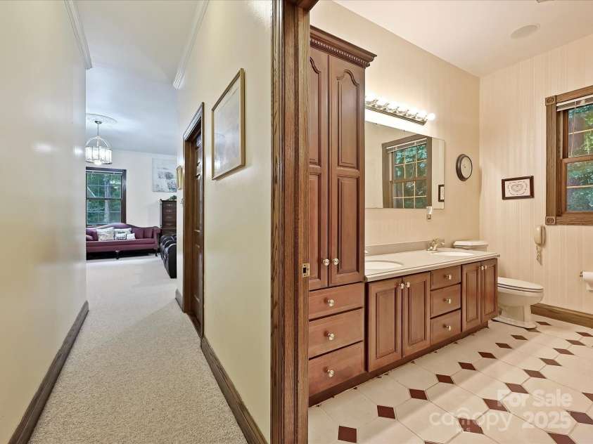 4900 Rocky River Road, Charlotte, NC 28215.  MLS# CAR4283934, YatesRealty ID 31470. Hallway leading to Primary Bathroom & Bedroom