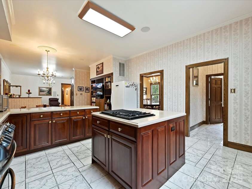 4900 Rocky River Road, Charlotte, NC 28215.  MLS# CAR4283934, YatesRealty ID 31470. Kitchen shows entry to DR