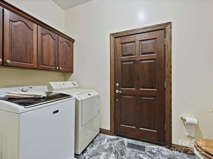 4900 Rocky River Road, Charlotte, NC 28215.  MLS# CAR4283934, YatesRealty ID 31470. Laundry room/half bath, door enters into indoor pool area