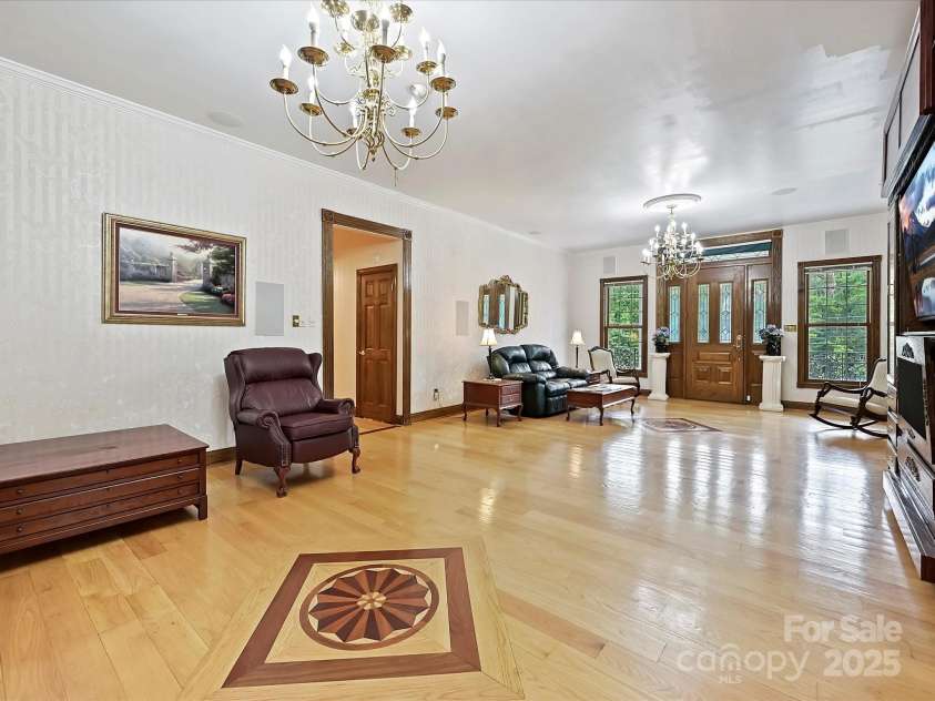 4900 Rocky River Road, Charlotte, NC 28215.  MLS# CAR4283934, YatesRealty ID 31470. LR 2 showing entrance to hallway leading to bedrooms