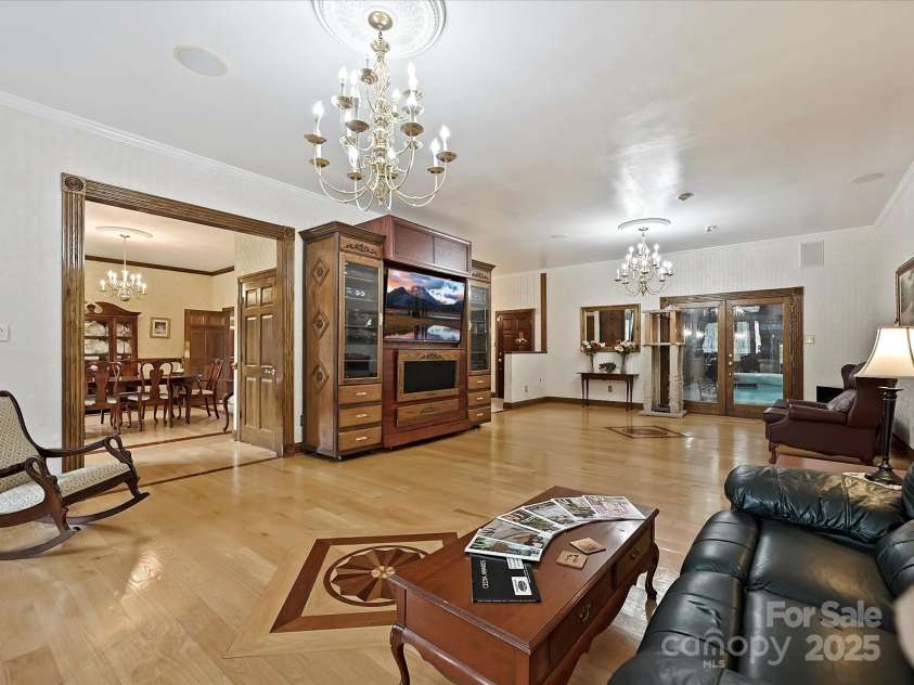 4900 Rocky River Road, Charlotte, NC 28215.  MLS# CAR4283934, YatesRealty ID 31470. LR showing entry to DR, Pool