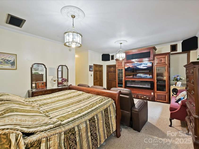 4900 Rocky River Road, Charlotte, NC 28215.  MLS# CAR4283934, YatesRealty ID 31470. Primary Bedroom has entertainment area, 2 walk-in closets