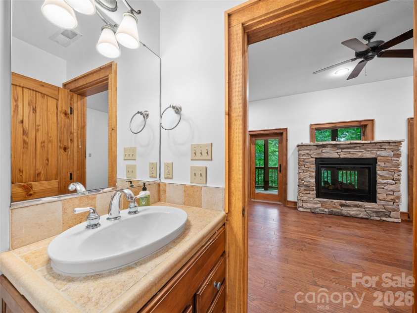 47 Falls Crossing Road, Burnsville, NC 28714.  MLS# CAR4393417, YatesRealty ID 31476. DOUBLE-SIDED FIREPLACE