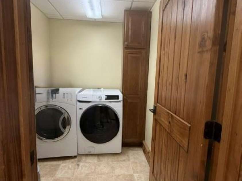 47 Falls Crossing Road, Burnsville, NC 28714.  MLS# CAR4393417, YatesRealty ID 31476. LL - LAUNDRY ROOM AND STORAGE