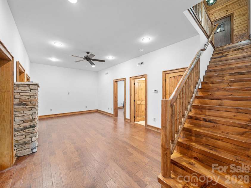 47 Falls Crossing Road, Burnsville, NC 28714.  MLS# CAR4393417, YatesRealty ID 31476. LOWER-LEVEL MEDIA/REC ROOM