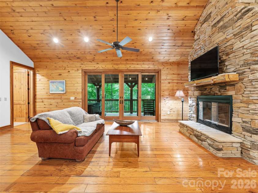 47 Falls Crossing Road, Burnsville, NC 28714.  MLS# CAR4393417, YatesRealty ID 31476. STONE-STACKED FIREPLACE