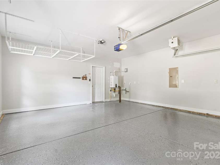 9027 Leah Meadow Lane, Charlotte, NC 28227.  MLS# CAR4285740, YatesRealty ID 31484. Attached 2-car garage with expoxy floor