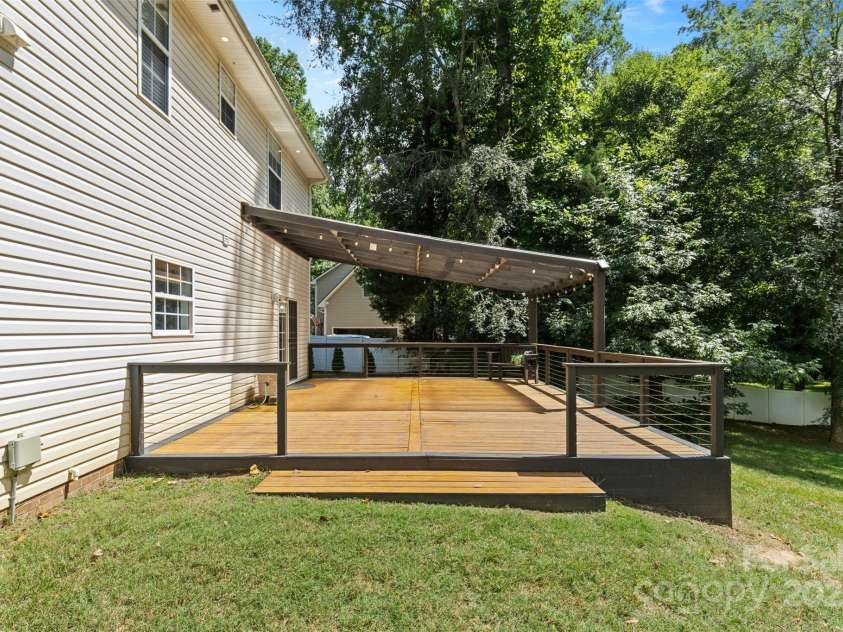 9027 Leah Meadow Lane, Charlotte, NC 28227.  MLS# CAR4285740, YatesRealty ID 31484. Best of everything - Deck half with pergola, half open to the sun!
