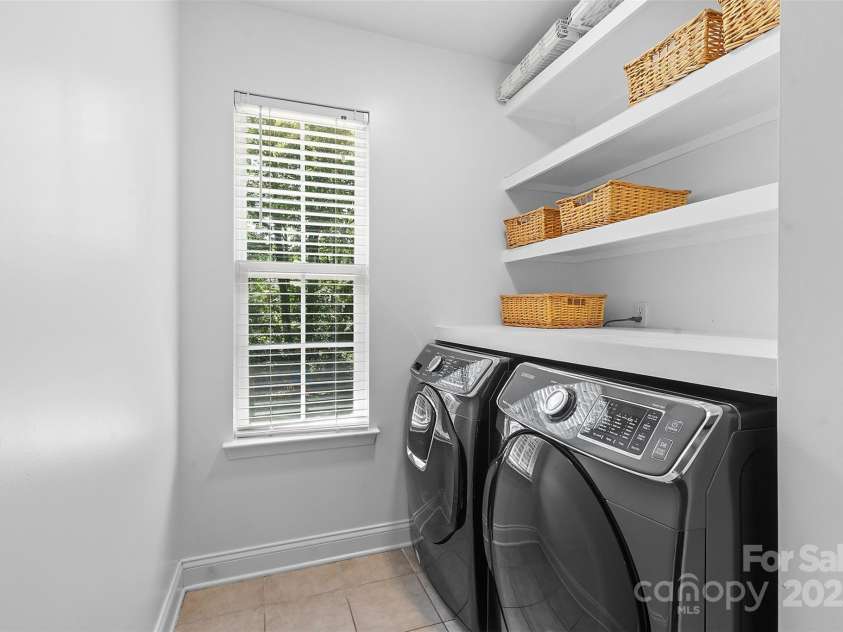 9027 Leah Meadow Lane, Charlotte, NC 28227.  MLS# CAR4285740, YatesRealty ID 31484. Excellent laundry room complete with washer and dryer!