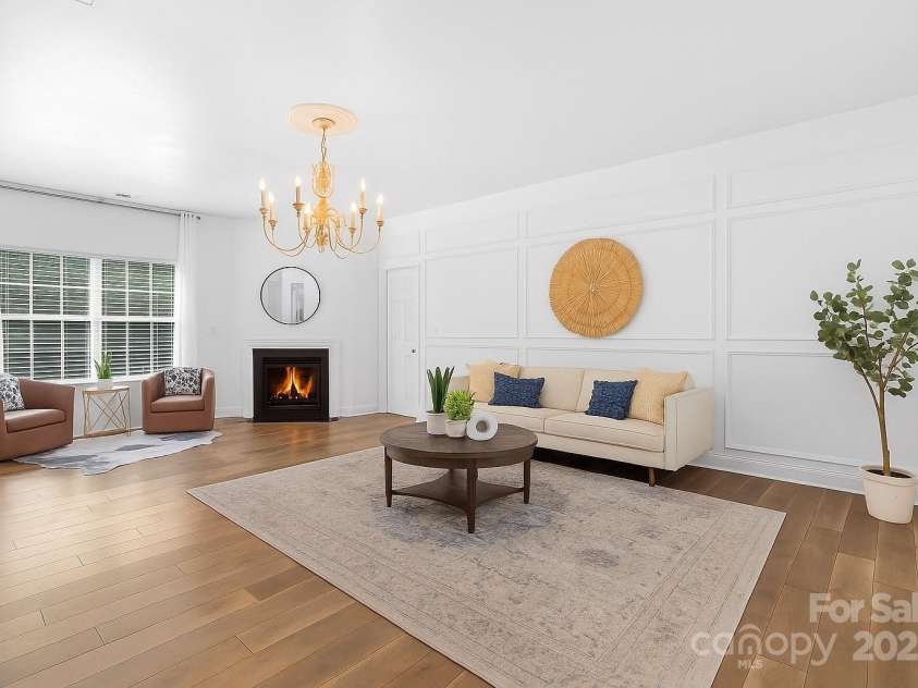 9027 Leah Meadow Lane, Charlotte, NC 28227.  MLS# CAR4285740, YatesRealty ID 31484. Spacious Living Room (fire is enhanced)