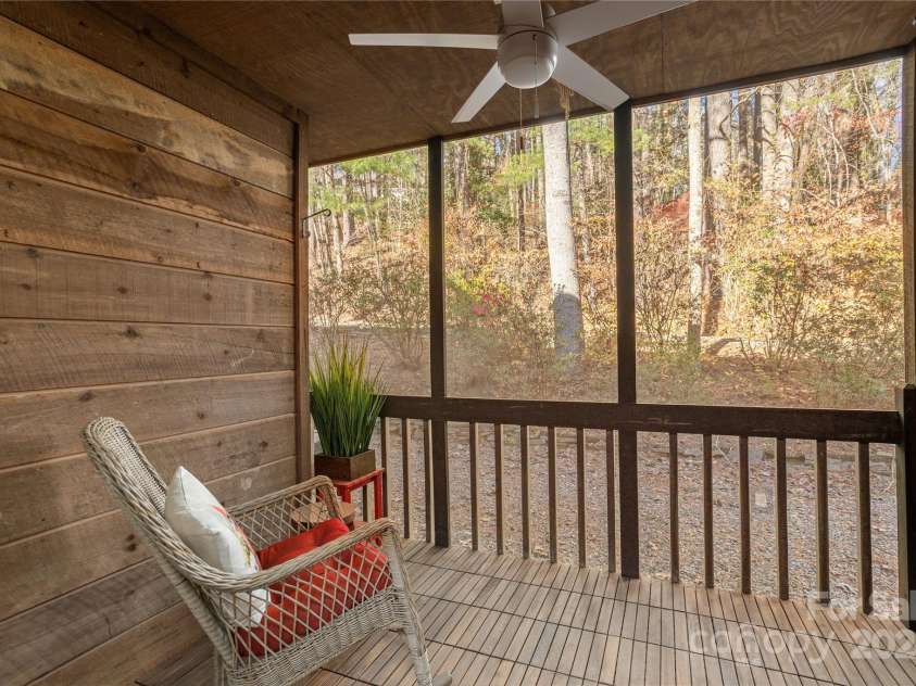 49 Lake Drive, Hendersonville, NC 28739.  MLS# CAR4204095, YatesRealty ID 3149. Peaceful Screened in back porch