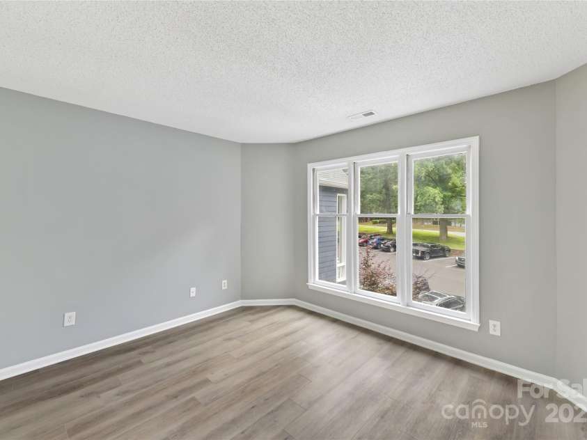 303 Northwest Drive, Davidson, NC 28036.  MLS# CAR4267438, YatesRealty ID 31490. Bedroom 2 with plenty of natural light!