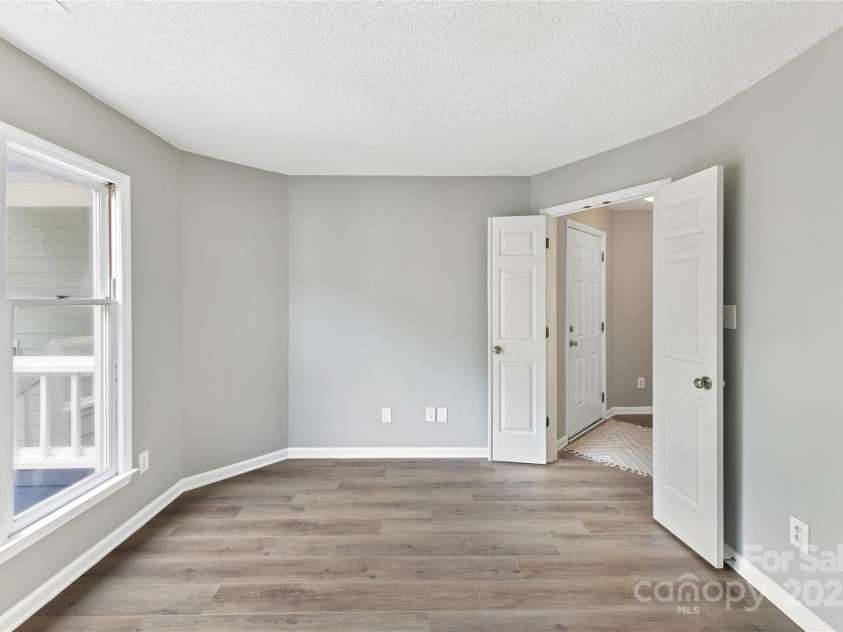 303 Northwest Drive, Davidson, NC 28036.  MLS# CAR4267438, YatesRealty ID 31490. Bedroom 2 with plenty of natural light!