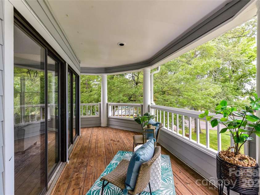 303 Northwest Drive, Davidson, NC 28036.  MLS# CAR4267438, YatesRealty ID 31490. Covered Deck with so much room to relax & enjoy amazing & peaceful water views!