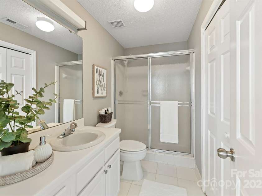 303 Northwest Drive, Davidson, NC 28036.  MLS# CAR4267438, YatesRealty ID 31490. Full Bath features shower & tile flooring!
