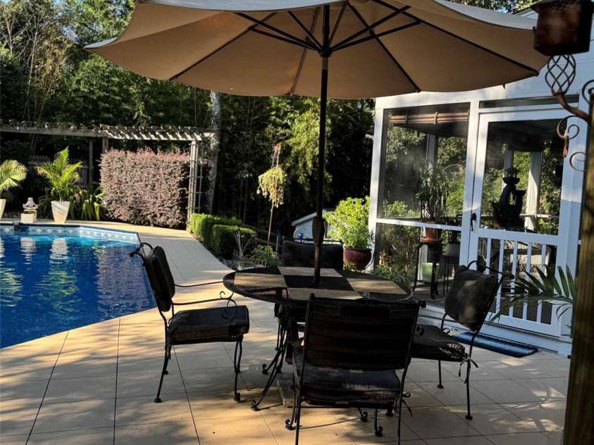 12532 Headquarters Farm Road, Charlotte, NC 28262.  MLS# CAR4275884, YatesRealty ID 31493. OUT DOOR DINING ON LARGER PATIO AREA