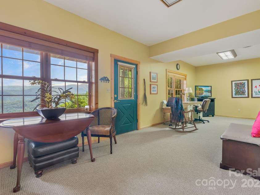 90 Forest Ridge Road, Burnsville, NC 28714.  MLS# CAR4176437, YatesRealty ID 3151. Basement Family Room 