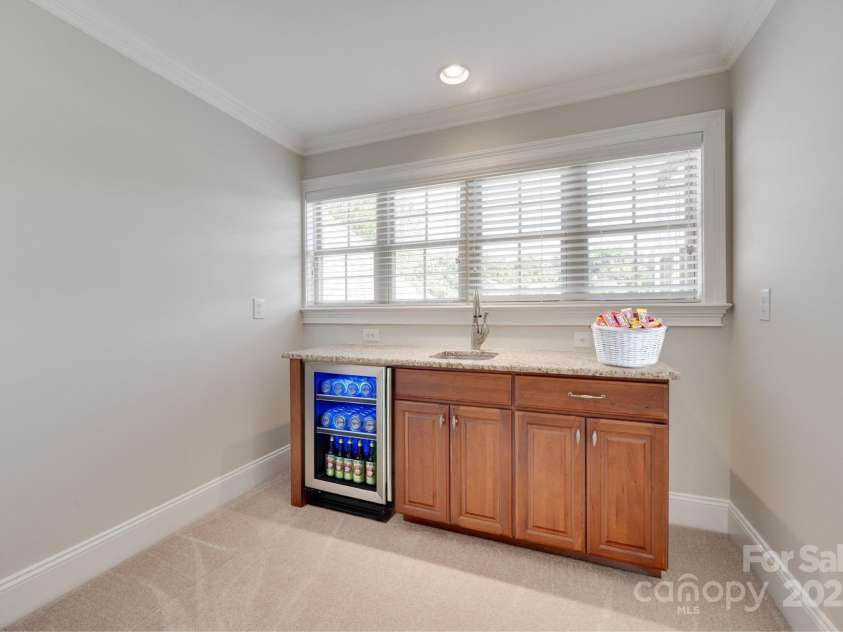 5164 Mill Race Lane, Lancaster, SC 29720.  MLS# CAR4265015, YatesRealty ID 31530. Virtually Staged Upstairs Bar. Beverage Refrigerator Has Been Removed.