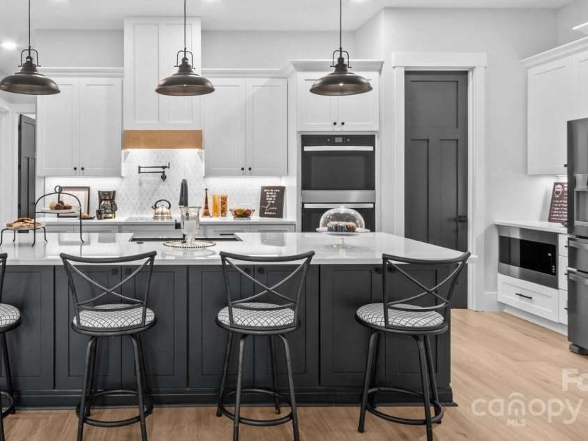 1075 Lake Wright Road, China Grove, NC 28023.  MLS# CAR4278354, YatesRealty ID 31532. Appliances include the Refrigerator, 2 ovens, cooktop, dishwasher, microwave & pot filler.